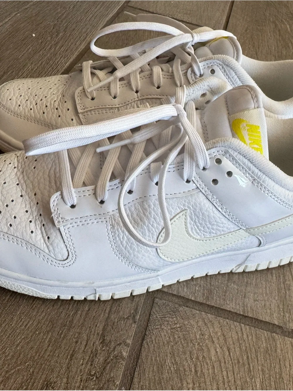 Nike White Low-Top Sneakers with Yellow Logo Accents